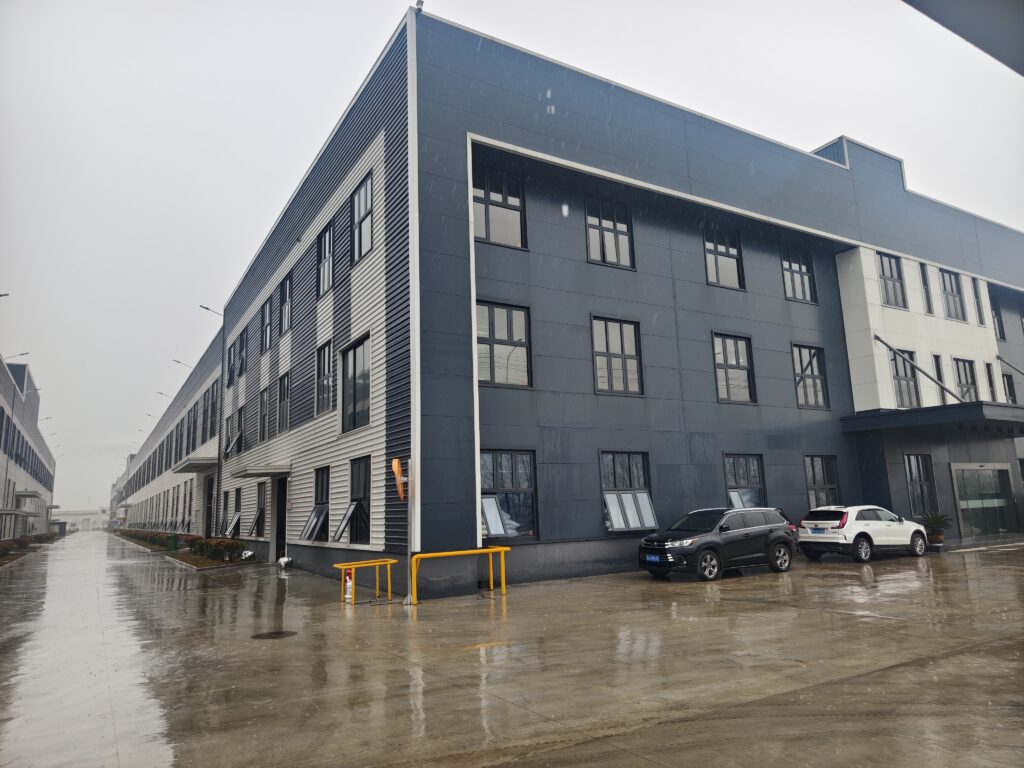 Exterior of a factory building with a striped facade