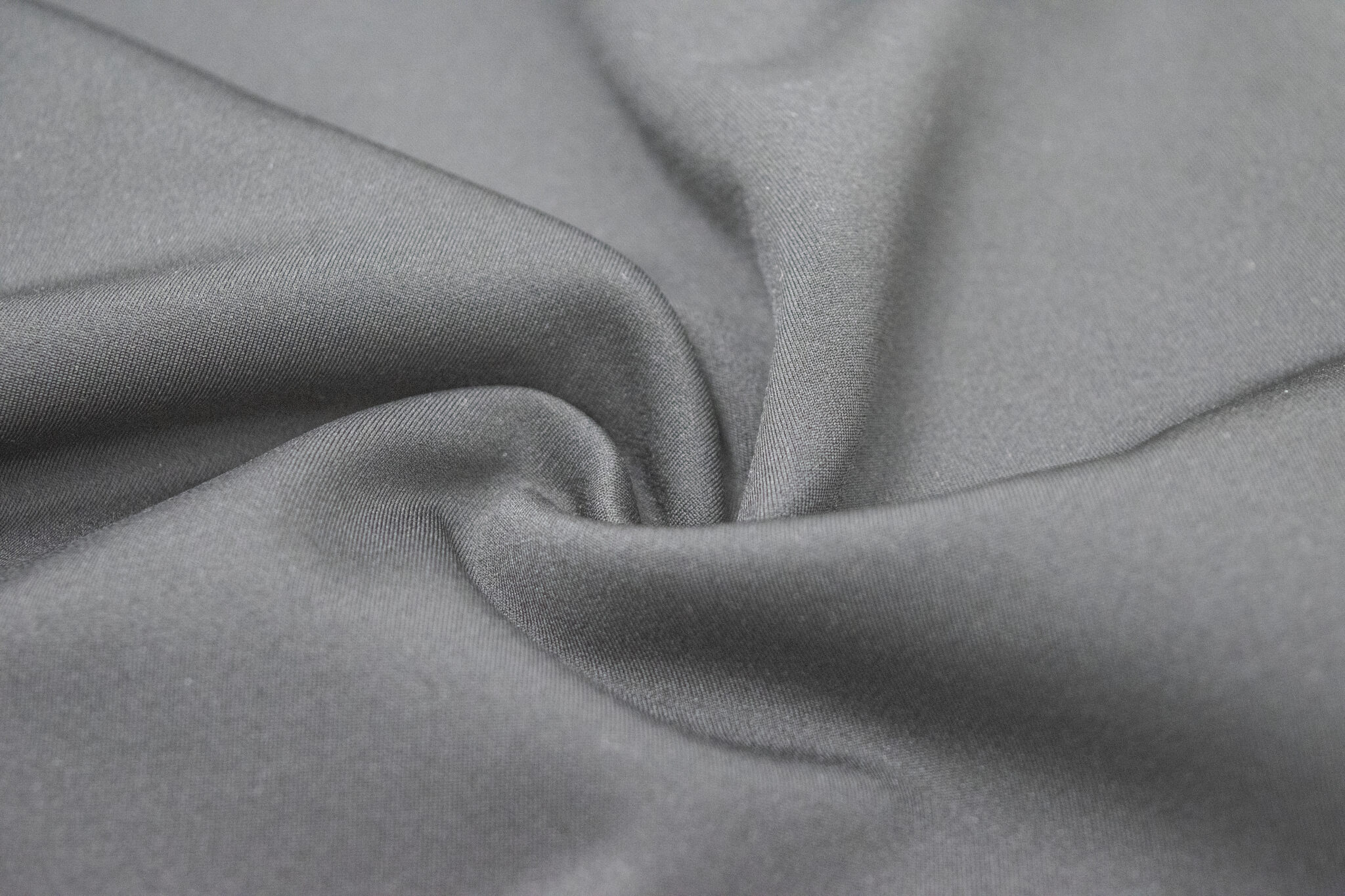 Close-up of a compact double-knit thermal fabric structure used for insulating mid-layers