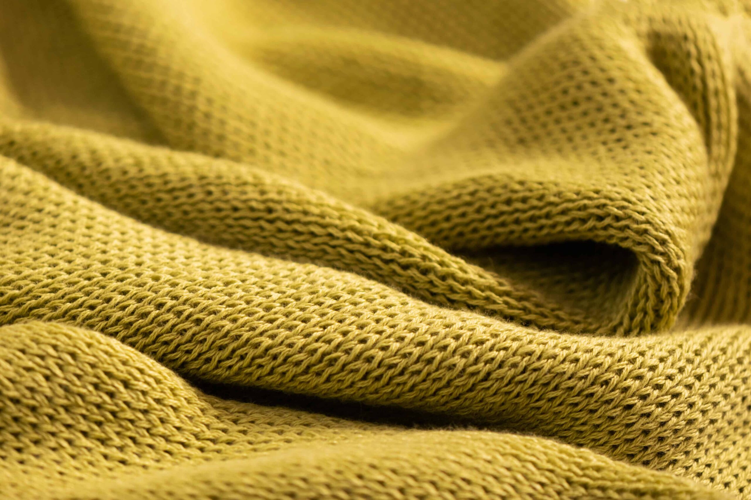 Finished performance knit fabric with a soft, cozy hand-feel ready for apparel production