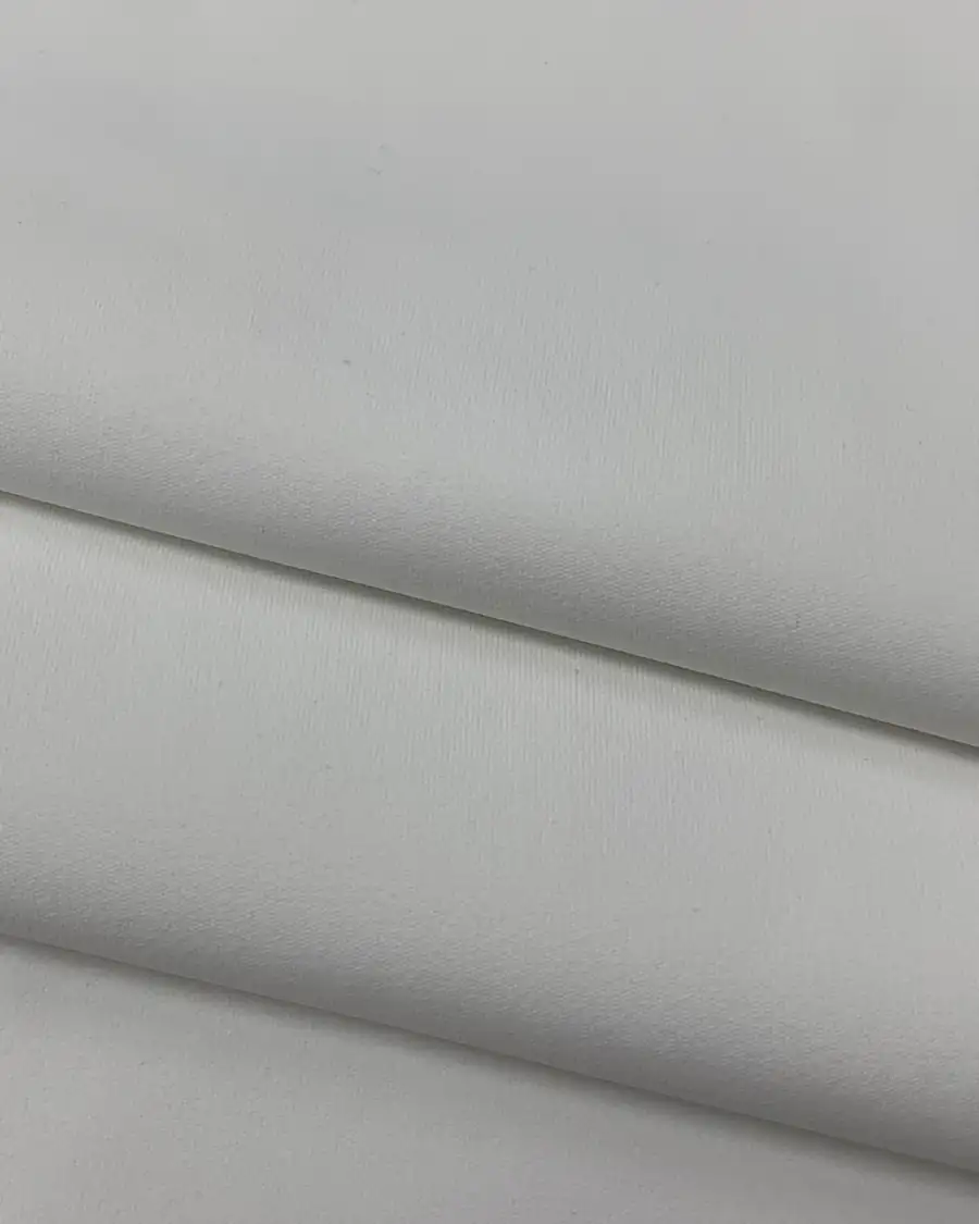 White anti-sheer opaque knit fabric folded to show its smooth non see-through surface